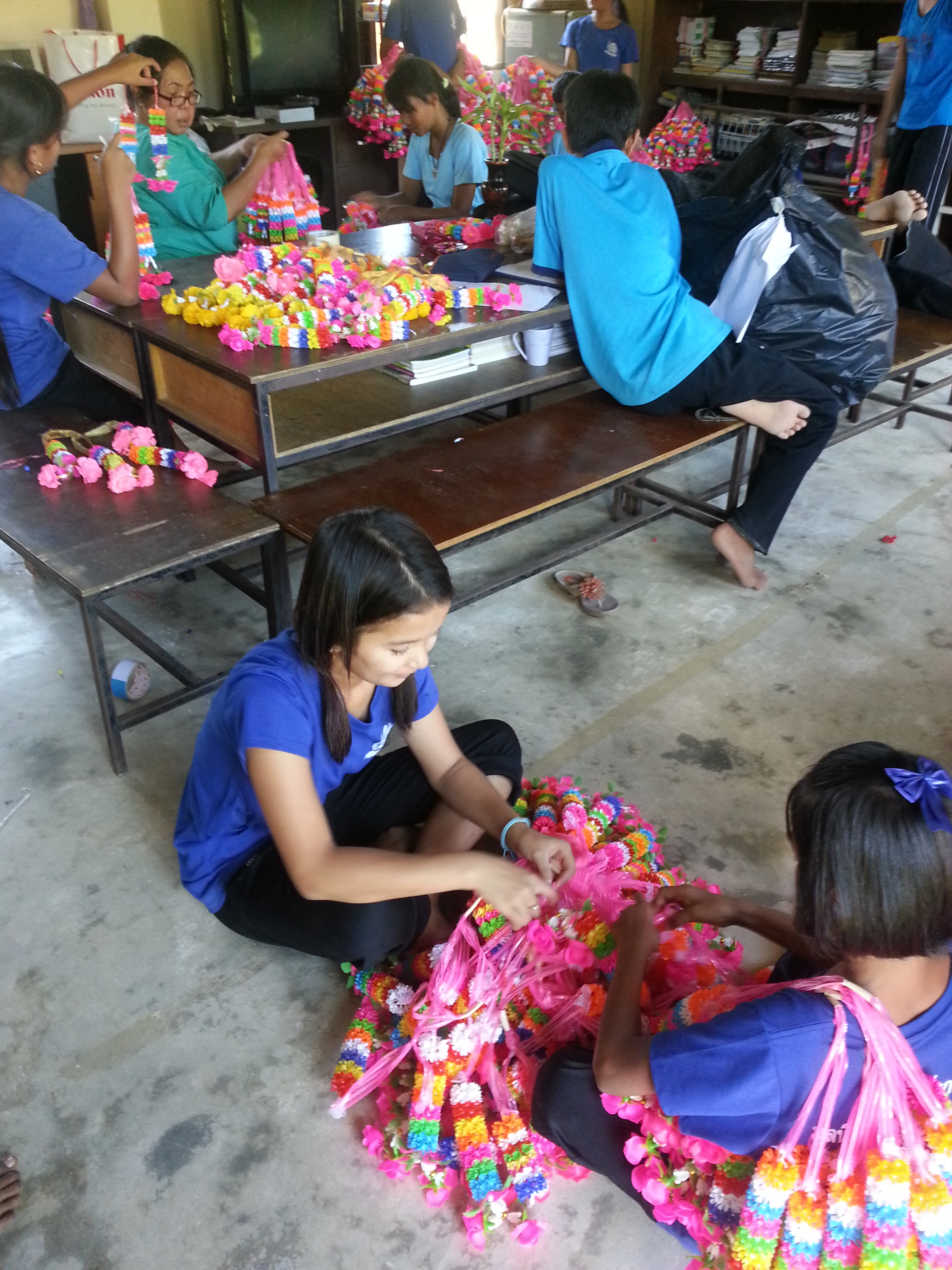 The day after the beauty pageant: students are assigned to detangle all of the flower garland thingy ma jigs.
